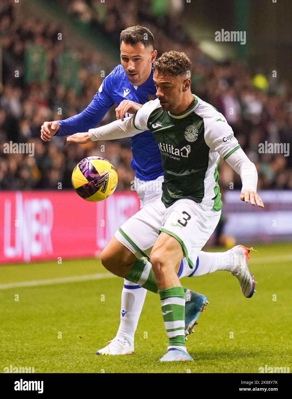 Hibernian's Marijan Cabraja (right) and St Johnstone's Ryan McGowan battle for the ball during the cinch Premiership match at Easter Road, Edinburgh. Picture date: Friday October 21, 2022. Stock Photo