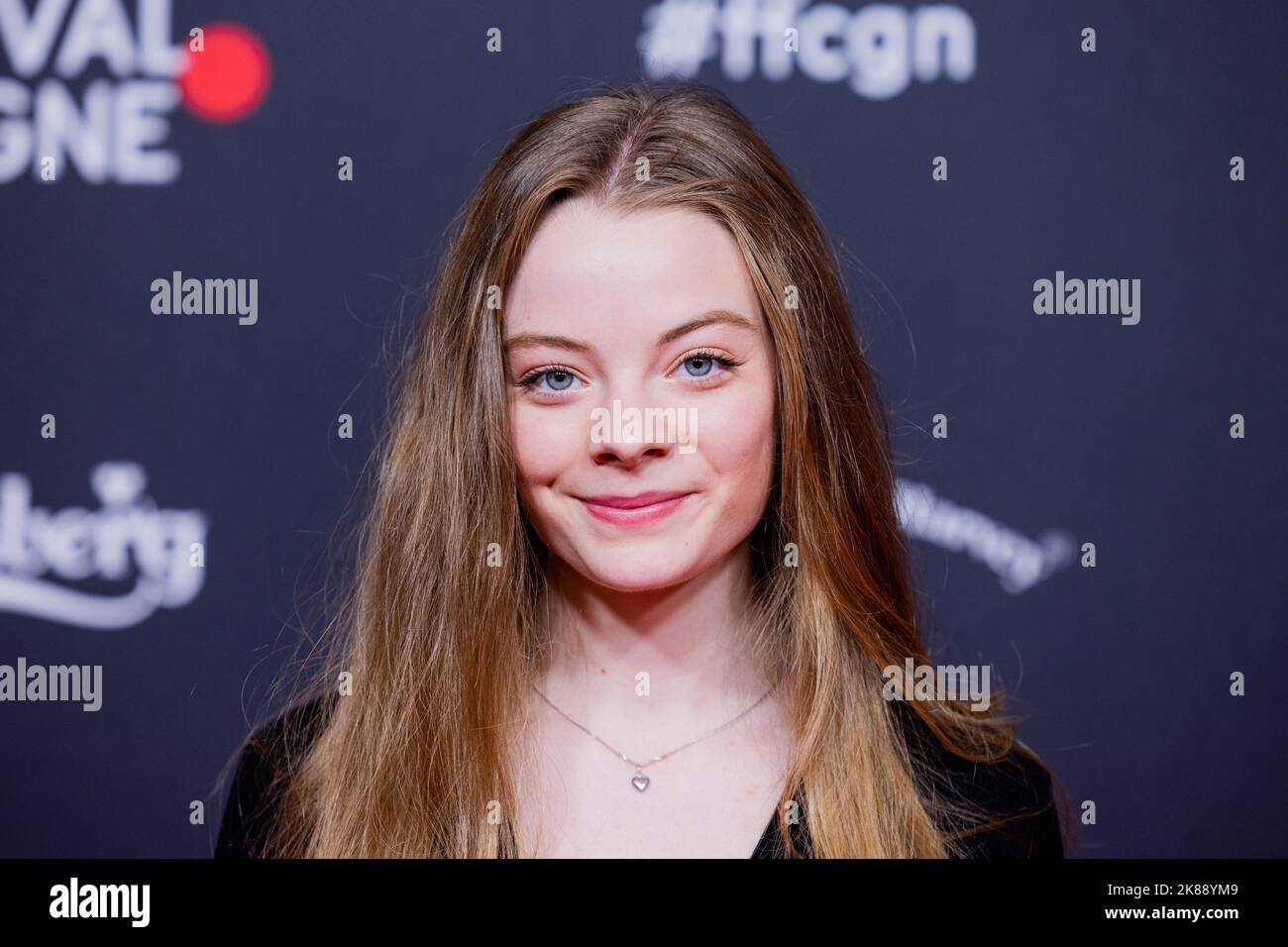 Cologne, Germany. 21st Oct, 2022. Charlotte Lorenzen, actress, arrives at the premiere of the Tatort episode 'Spur des Blutes' at Film Festival Cologne. The investigative team of the Cologne Tatort celebrates the 25th anniversary of service. Credit: Rolf Vennenbernd/dpa/Alamy Live News Stock Photo