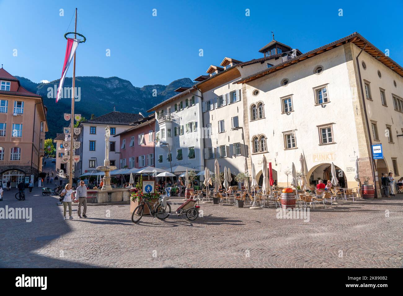 The village of Kaltern, on the South Tyrolean Wine Road, market square, South Tyrolean flag, Italy Stock Photo