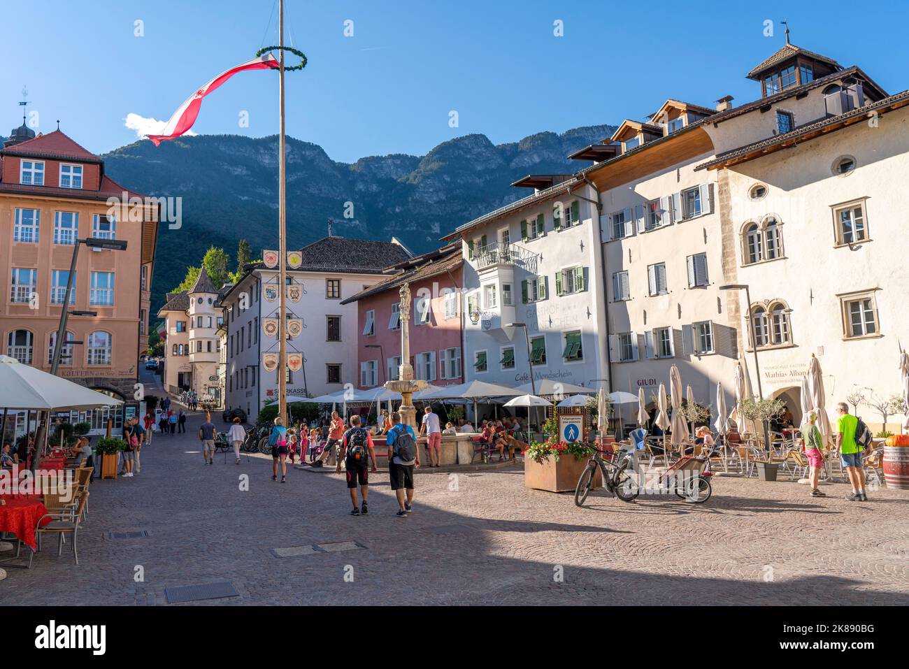 The village of Kaltern, on the South Tyrolean Wine Road, market square, South Tyrolean flag, Italy Stock Photo