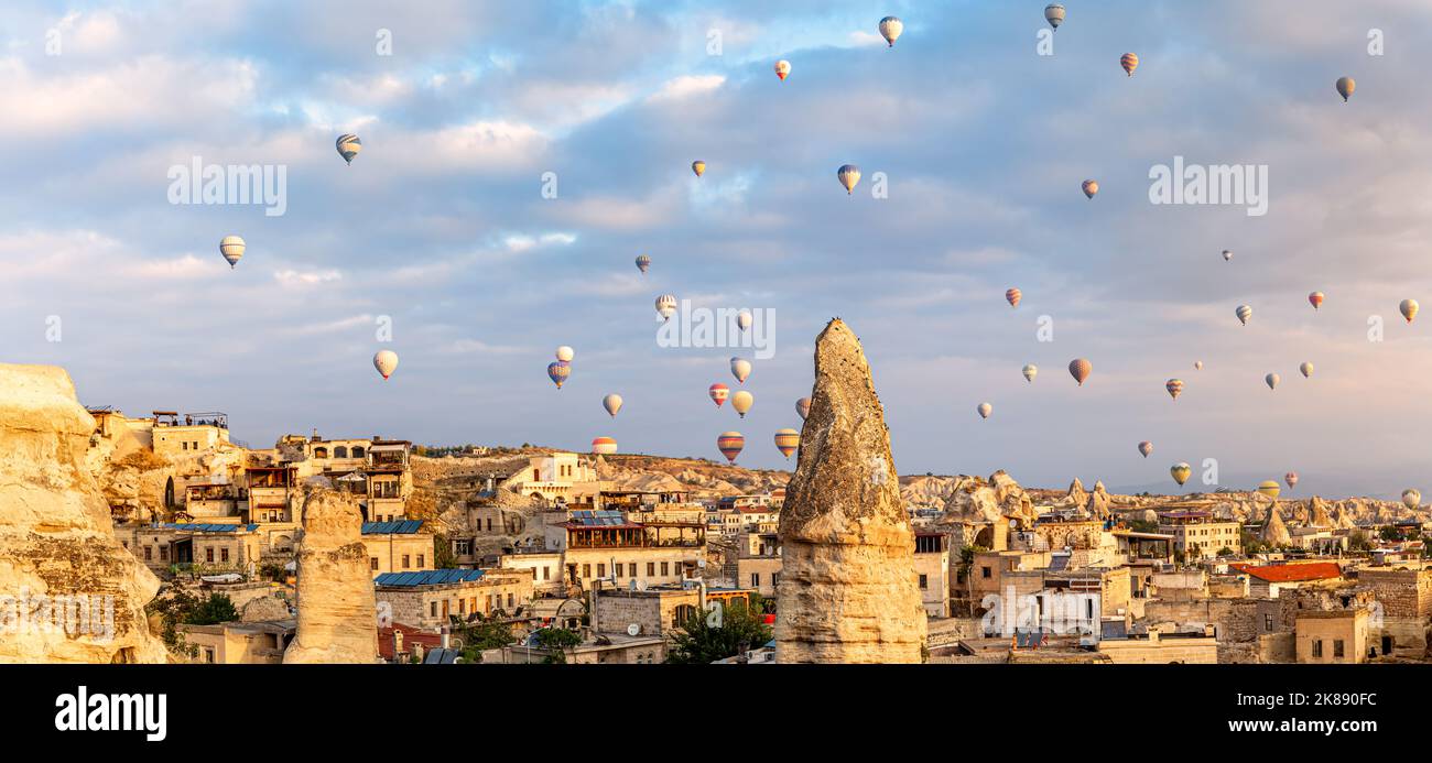 Panoramic view of Goreme, Turkey. Goreme is known for its fairy chimneys, eroded rock formations, many of which were hollowed out in the Middle Ages t Stock Photo