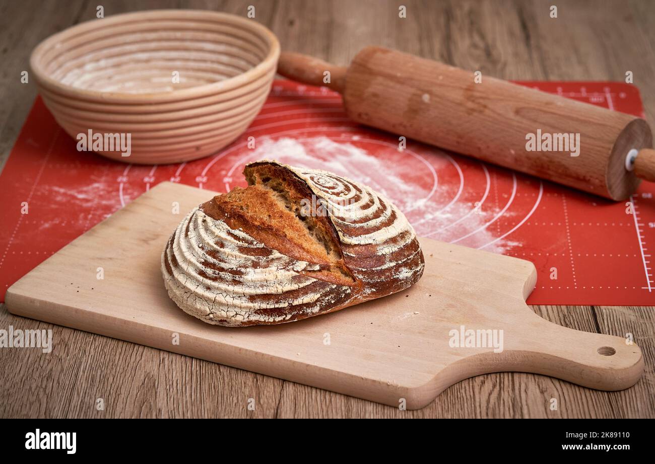 Traditional sourdough bread. Round loaf of freshly backed sourdough bread. Artisan Sourdough bread baked at home. Stock Photo