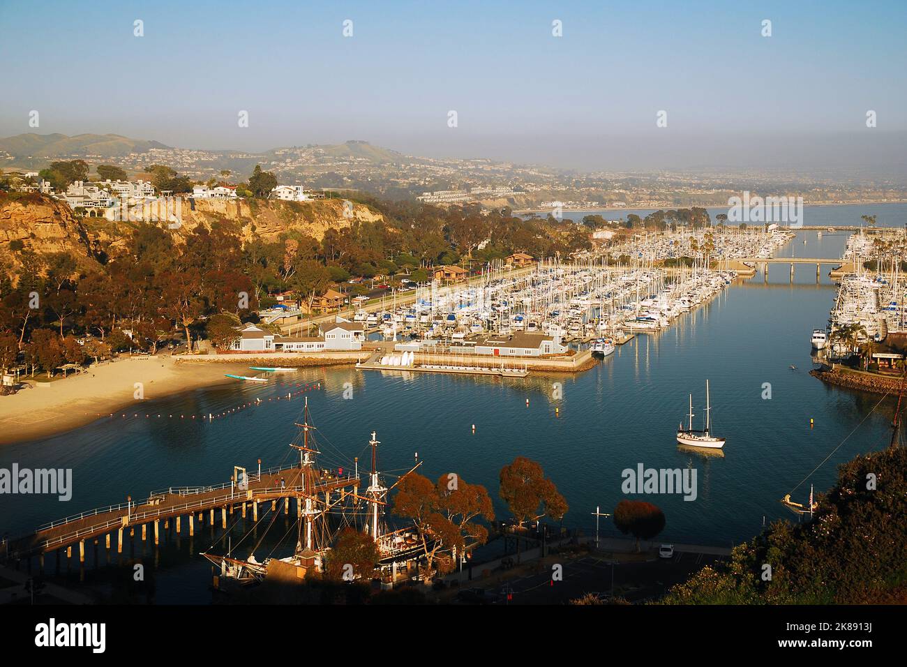 An aerial view of Dana Point, California shows the extensive marina with pleasure craft, ships and sailboats in the protective harbor Stock Photo