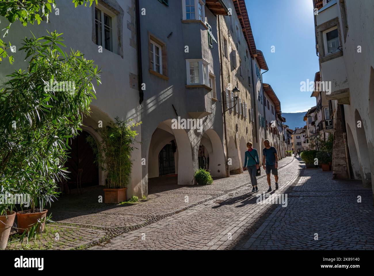 The town of Neumarkt, in the Adige Valley, in South Tyrol, arcades in the old town, in front of shops and restaurants, Italy Stock Photo