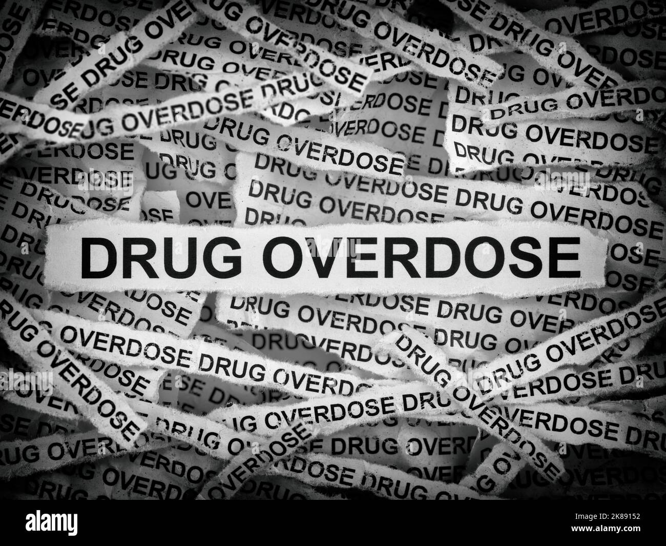 Strips of newspaper with the words Drug Overdose typed on them. Black and white. Close up. Stock Photo