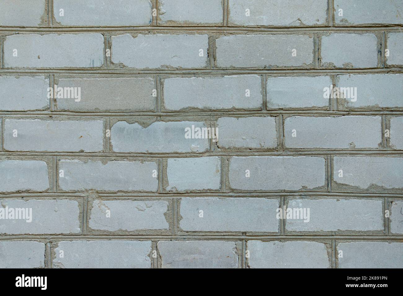 White brick wall made from used material. Abstract texture background image Stock Photo