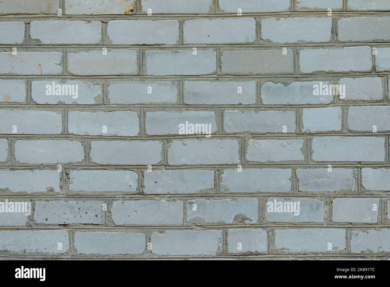 White brick wall made from used material. Abstract texture background image Stock Photo