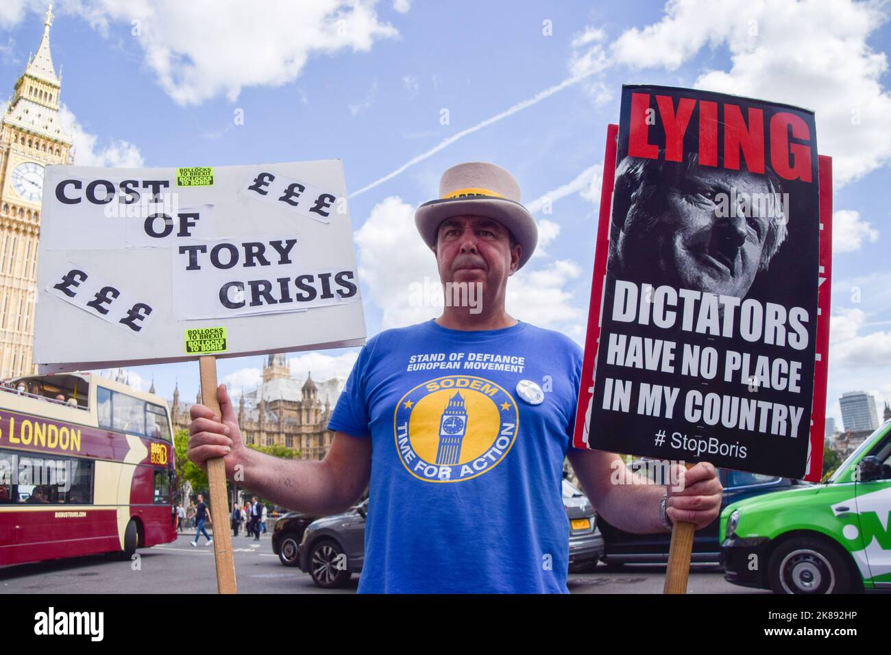 London, UK. 28th June 2022.  Anti-Brexit activist Steve Bray holds anti-Boris Johnson and anti-Tory placards during a protest in Parliament Square. Stock Photo