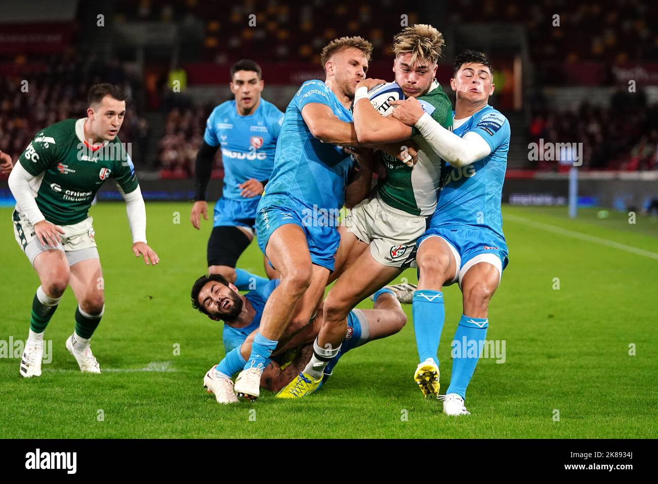 London Irish's Ollie Hassell-Collins is tackled by Gloucester Rugby's Giorgi Kveseldze during the Gallagher Premiership match at the Gtech Community Stadium, London. Picture date: Friday October 21, 2022. Stock Photo
