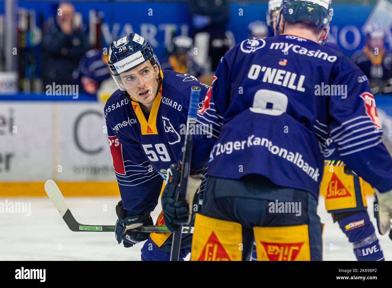 Dario Simion 59 (EV Zug) talks to Brian O'Neill 9 (EV Zug) during the