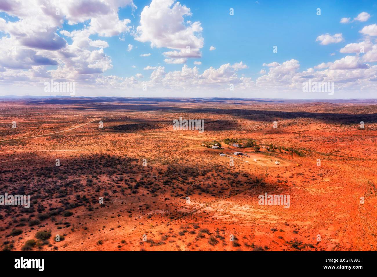 Remote homestead farm in red soil Australian outback near Broken hill city - aerial landscape to Silverton. Stock Photo