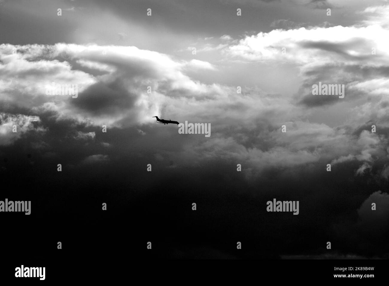 A passenger jet aircraft approaches a landing at Santa Fe Municipal Airport in Santa Fe, New Mexico. Stock Photo