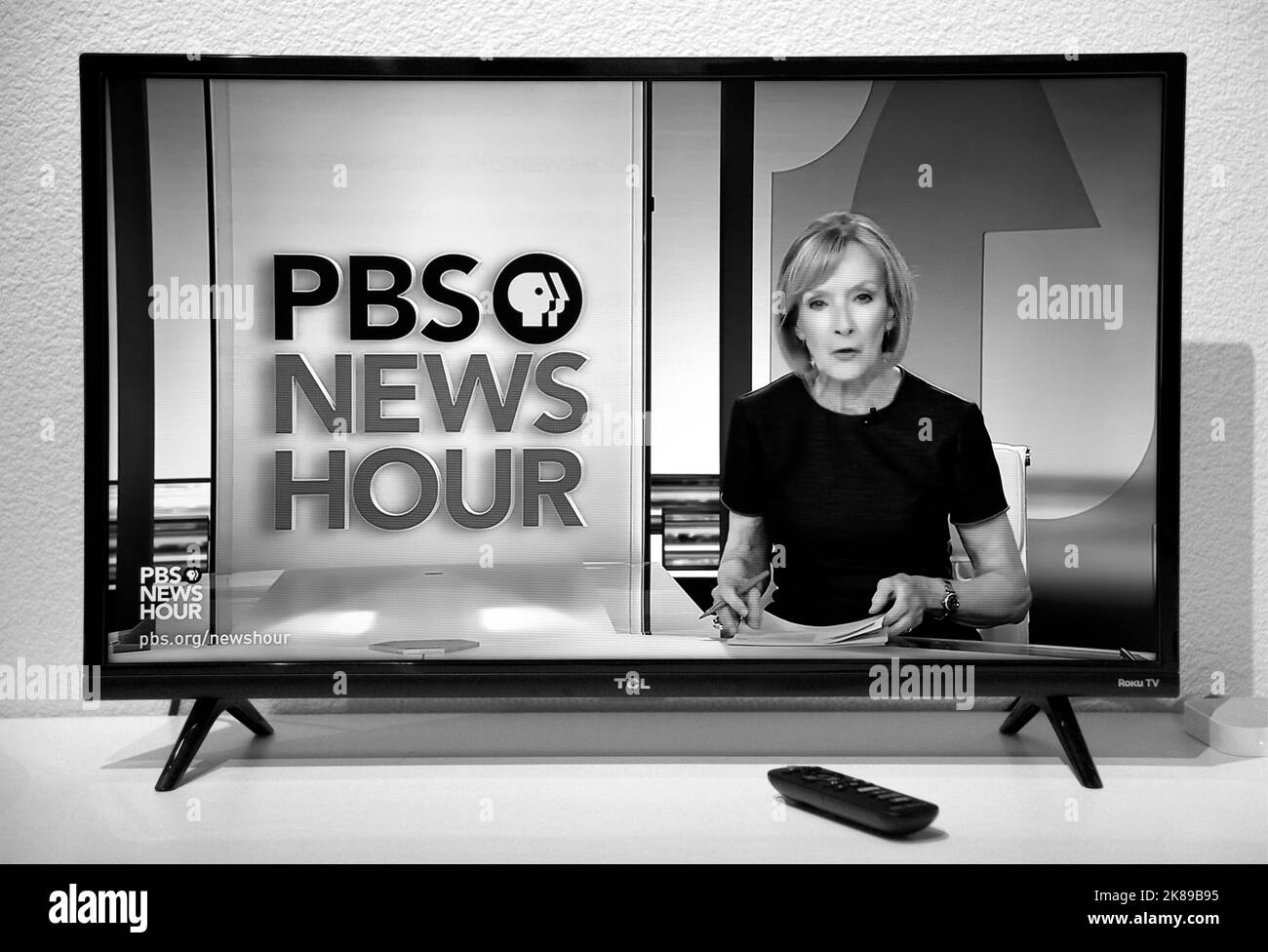 A television tuned to the PBS NewsHour and the program's anchor, Judy Woodruff. Stock Photo