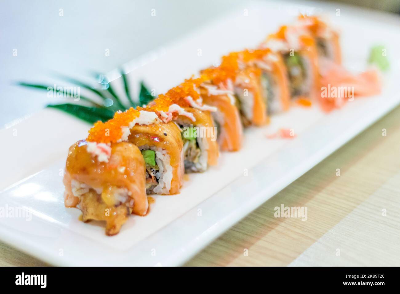 A salmon sushi roll at a restaurant in Phuket, Thailand Stock Photo