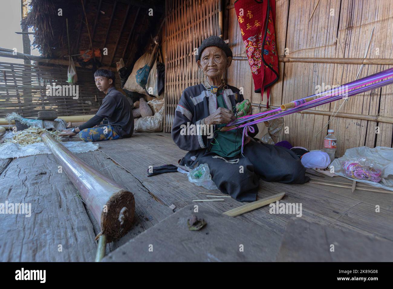Lahu Patterns Lahu woman seen weaving outside her home in Chiang Mai. The Lahu and ...