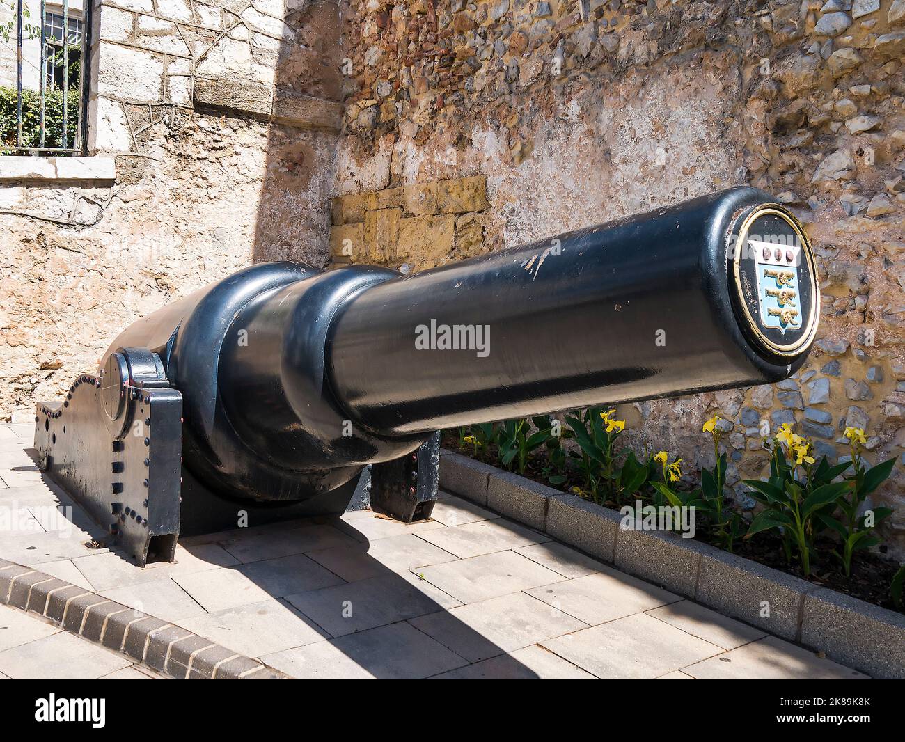 Artillery piece displaying a tampion with the Coat of Arms of the Royal Army Ordnance Corps is the 10-inch 18 ton gun at South Port Gate Gibraltar Stock Photo