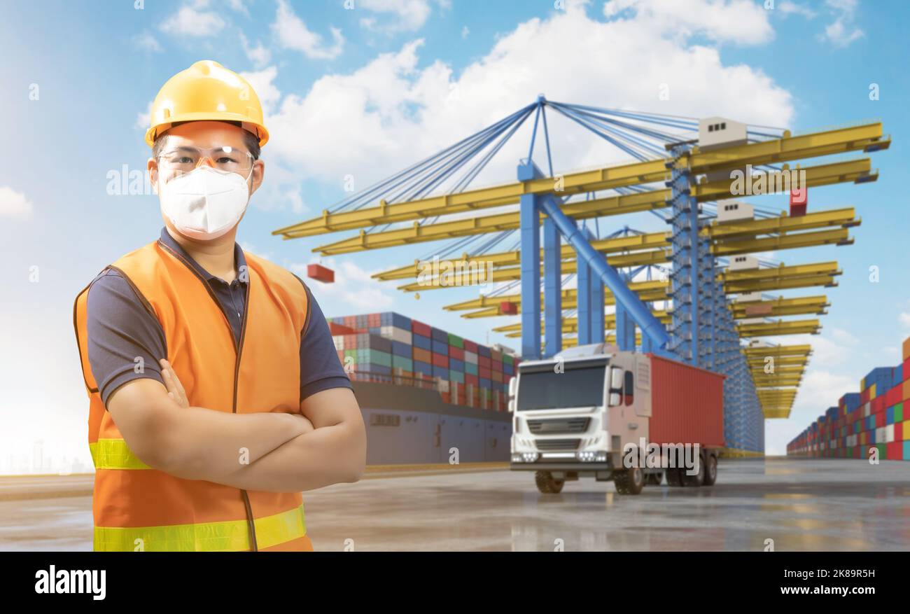 Engineer or asian worker work at container terminal port Stock Photo