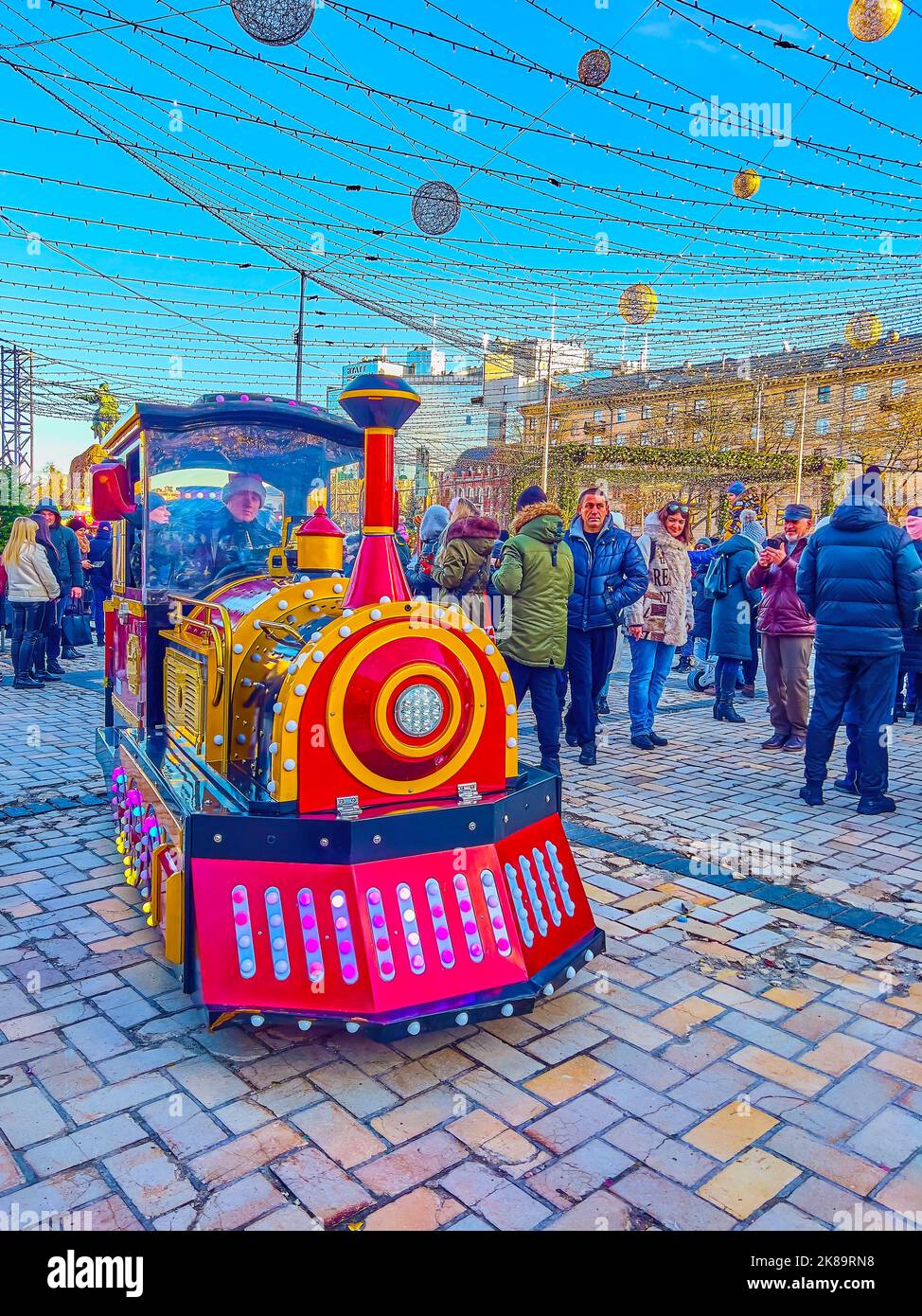 KYIV, UKRAINE - JANUARY 2, 2022: The tourist train at the Christmas Tree on St. Sophia Square, on January 2 in Kyiv, Ukraine Stock Photo
