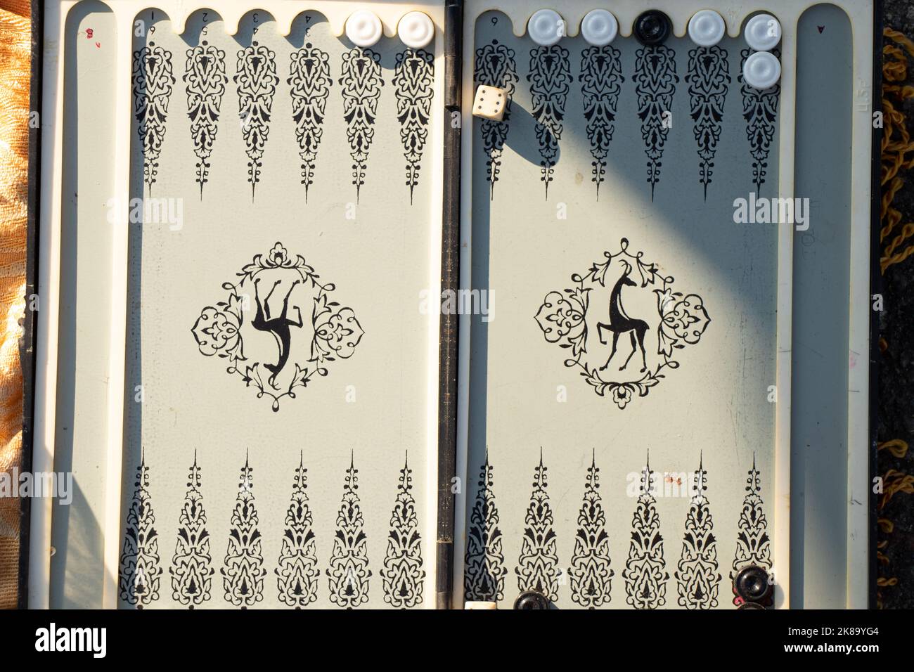 old backgammon game in the sun closeup,gambling and hobbies Stock Photo