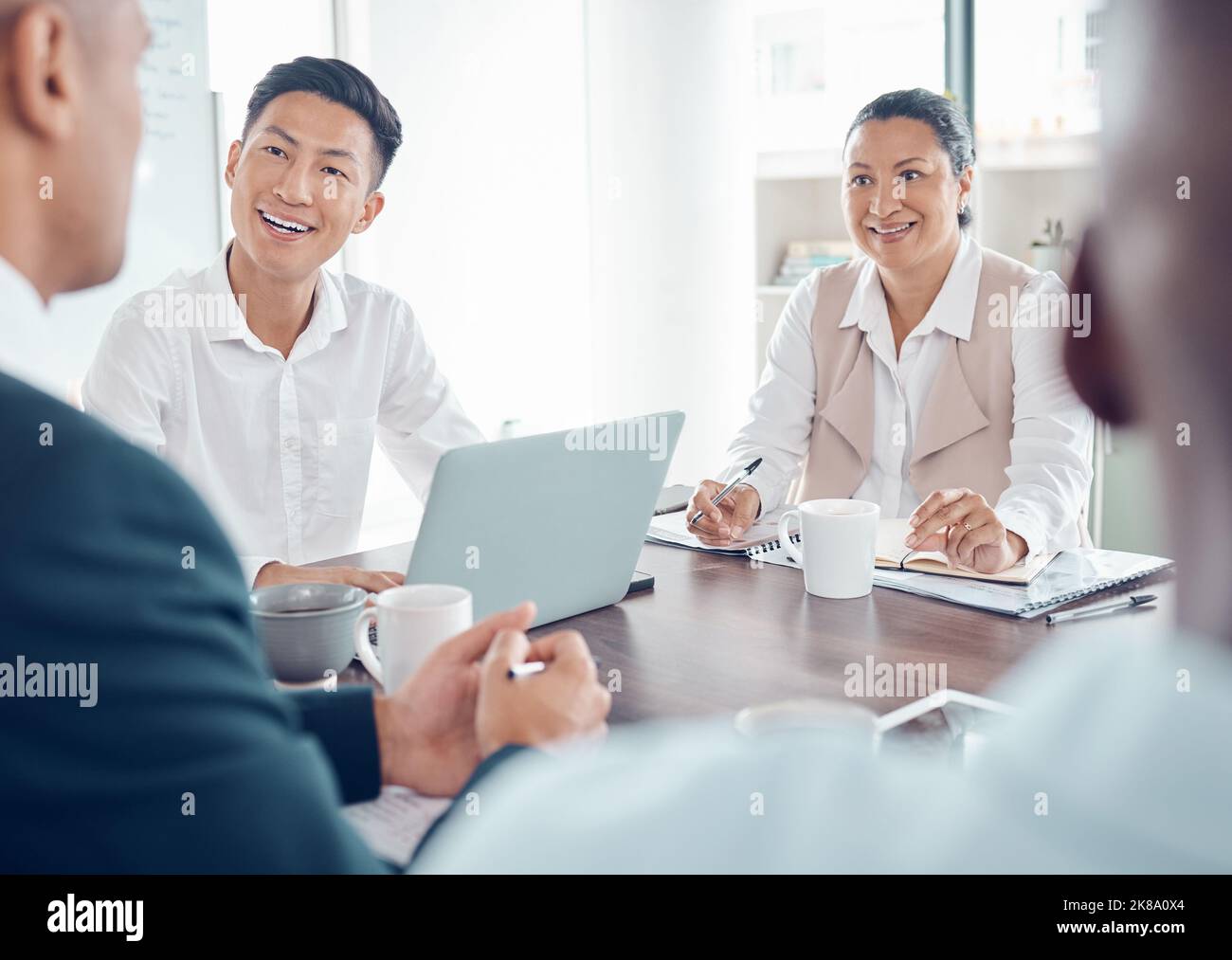Business people, collaboration and meeting, business and conference room discussion, diversity workers and technology making notes. Teamwork, working Stock Photo