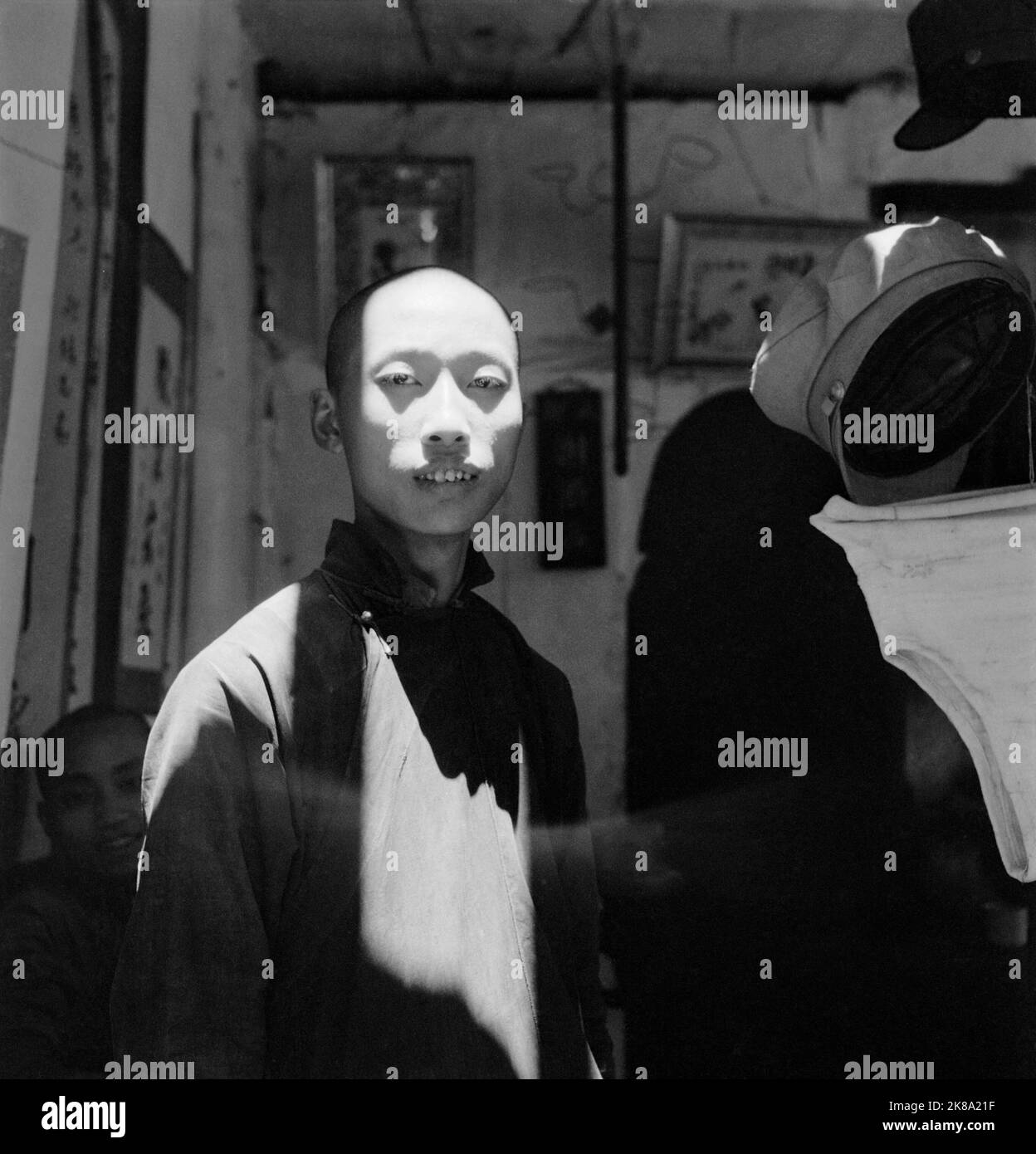 Cecil Beaton - General China 1944: A Chinese man dramatically lit as he