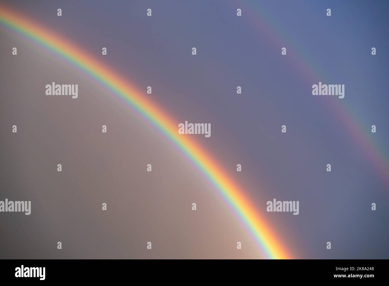 Rainbow clouds rain sun blue sky hi-res stock photography and images ...