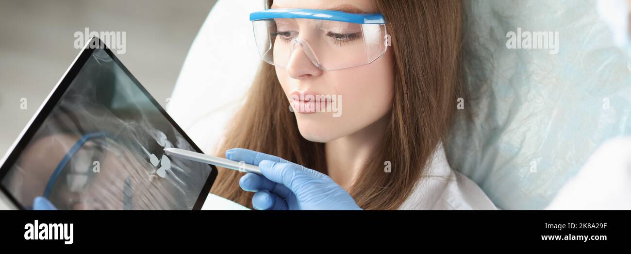 Patient On Consultation In Clinic Doctor Explain Problem With Teeth Patient on consultation in clinic doctor explain problem with teeth