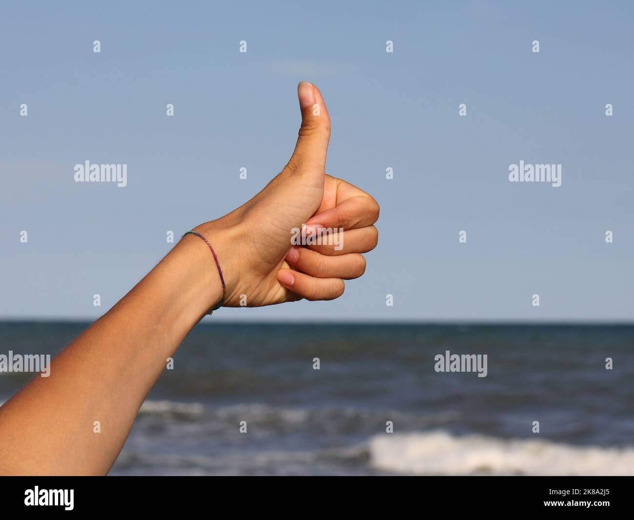 thumb up to indicate that everything is fine and there are no problems Stock Photo