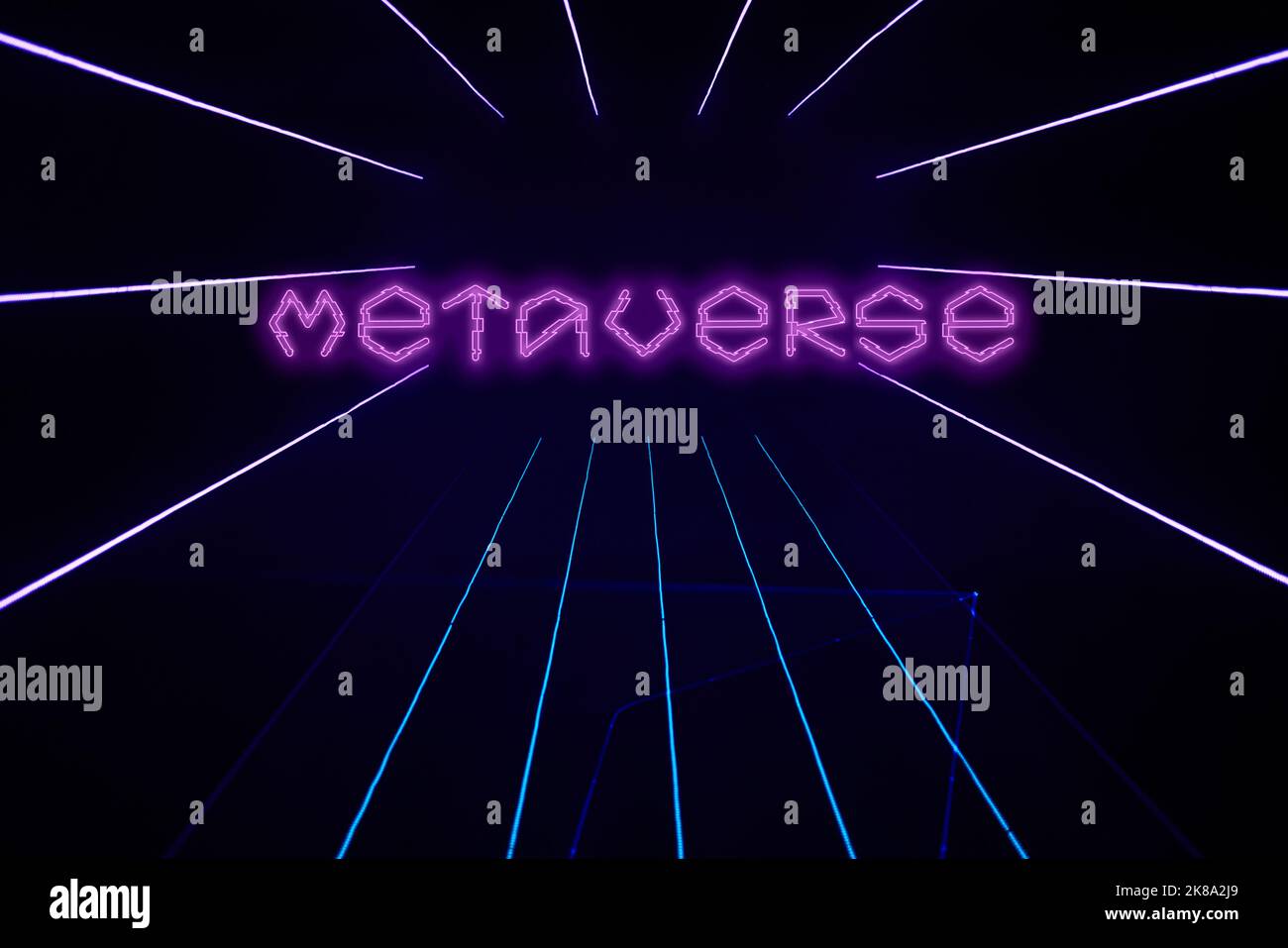 Dark background with purple laser beams and text Metaverse. Background for splash screen for gaming, cybersport and metaverse. Stock Photo