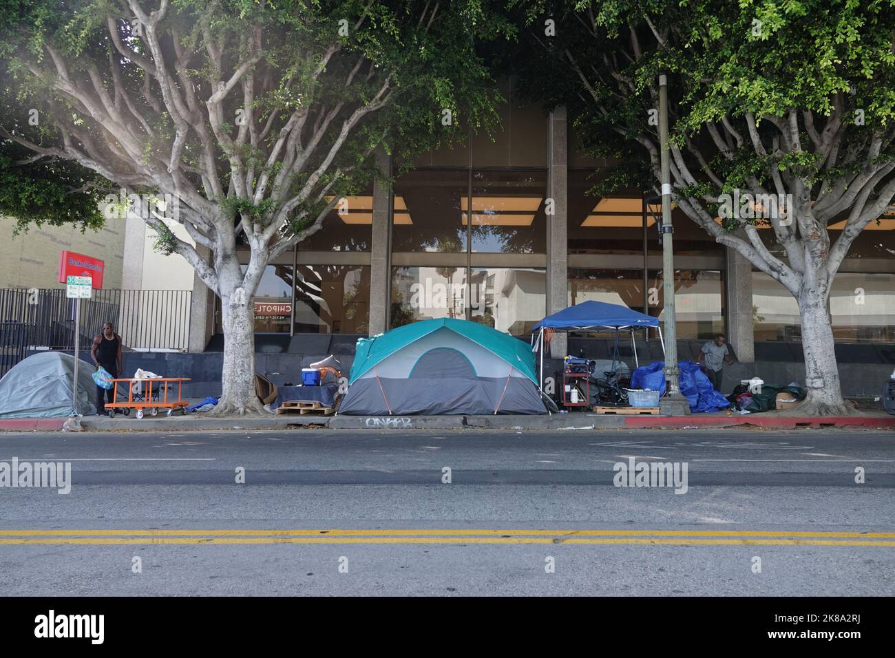Hollywood, California / USA - Oct. 12, 2022: Tents of unhoused people are shown along a sidewalk in Los Angeles during the day. For editorial uses onl Stock Photo