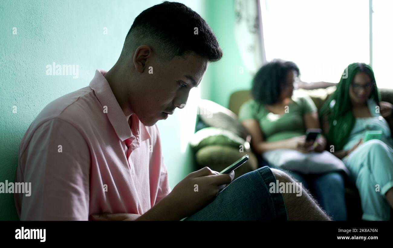 One hispanic man reading shocking news on cellphone. Person receiving unbelievable message notification Stock Photo