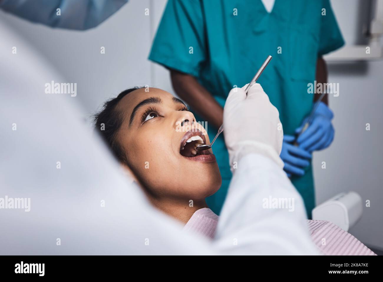 Keep your teeth healthy if you want to keep them around. a young woman