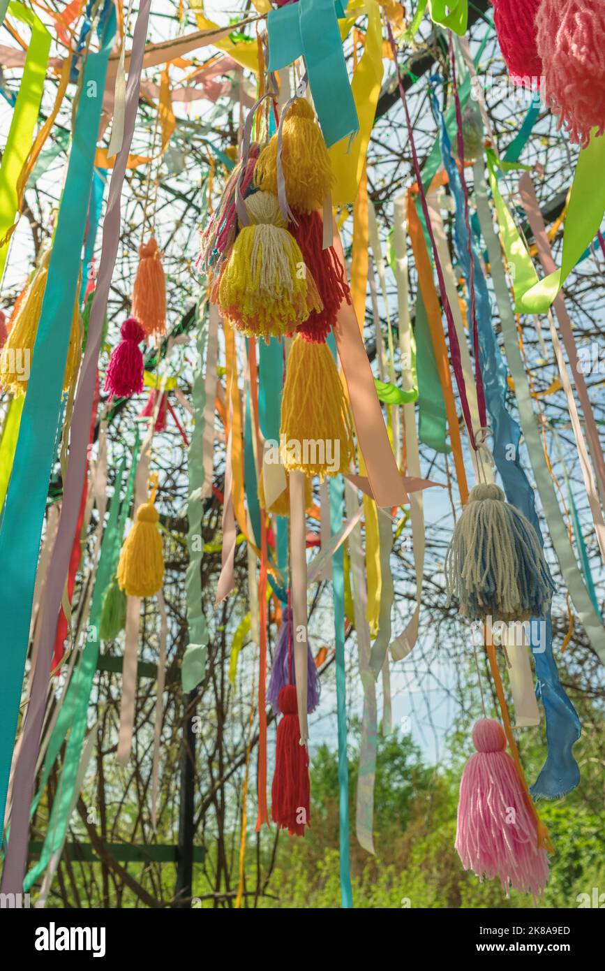 close up view of hanging from above colorful tassels and ribbons Stock Photo