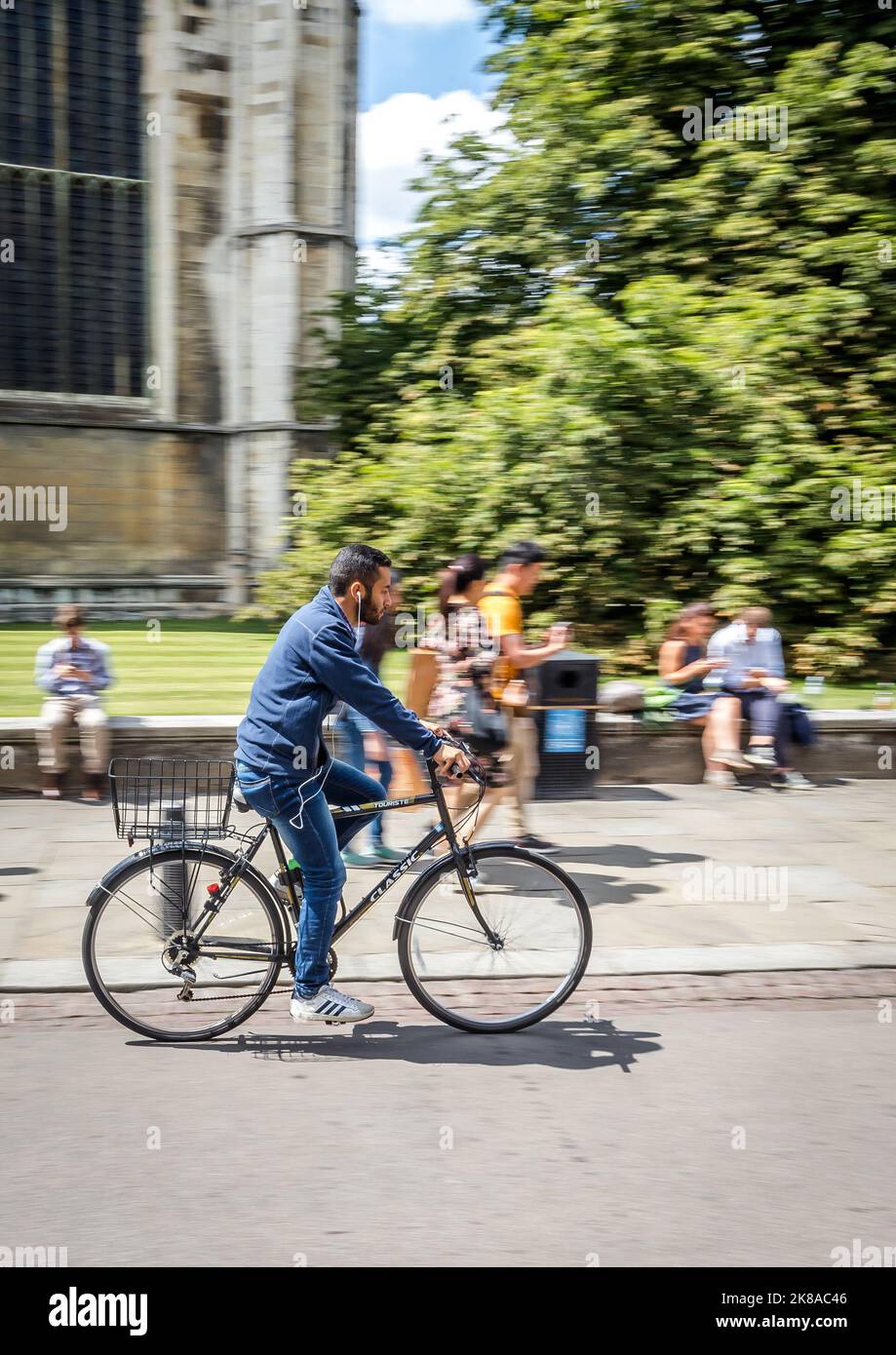 Students Cycling Past Universities n Cambridge UK Stock Photo