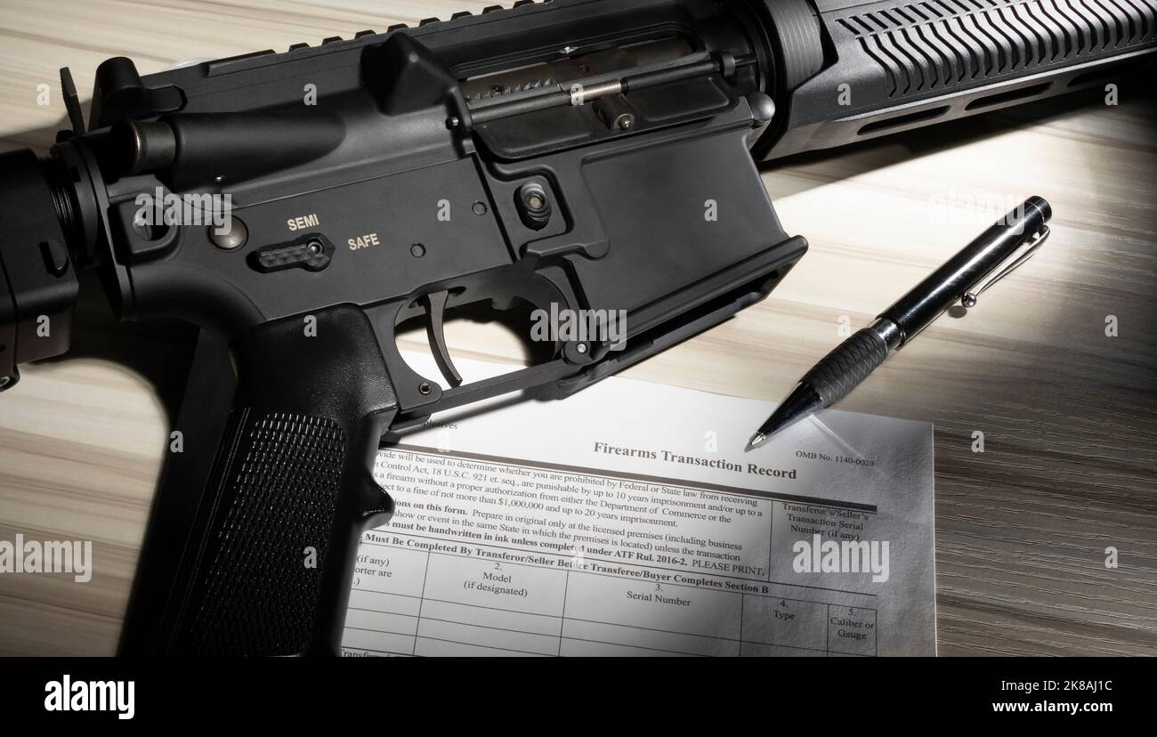 Firearm with public domain purchase form and pen Stock Photo Alamy