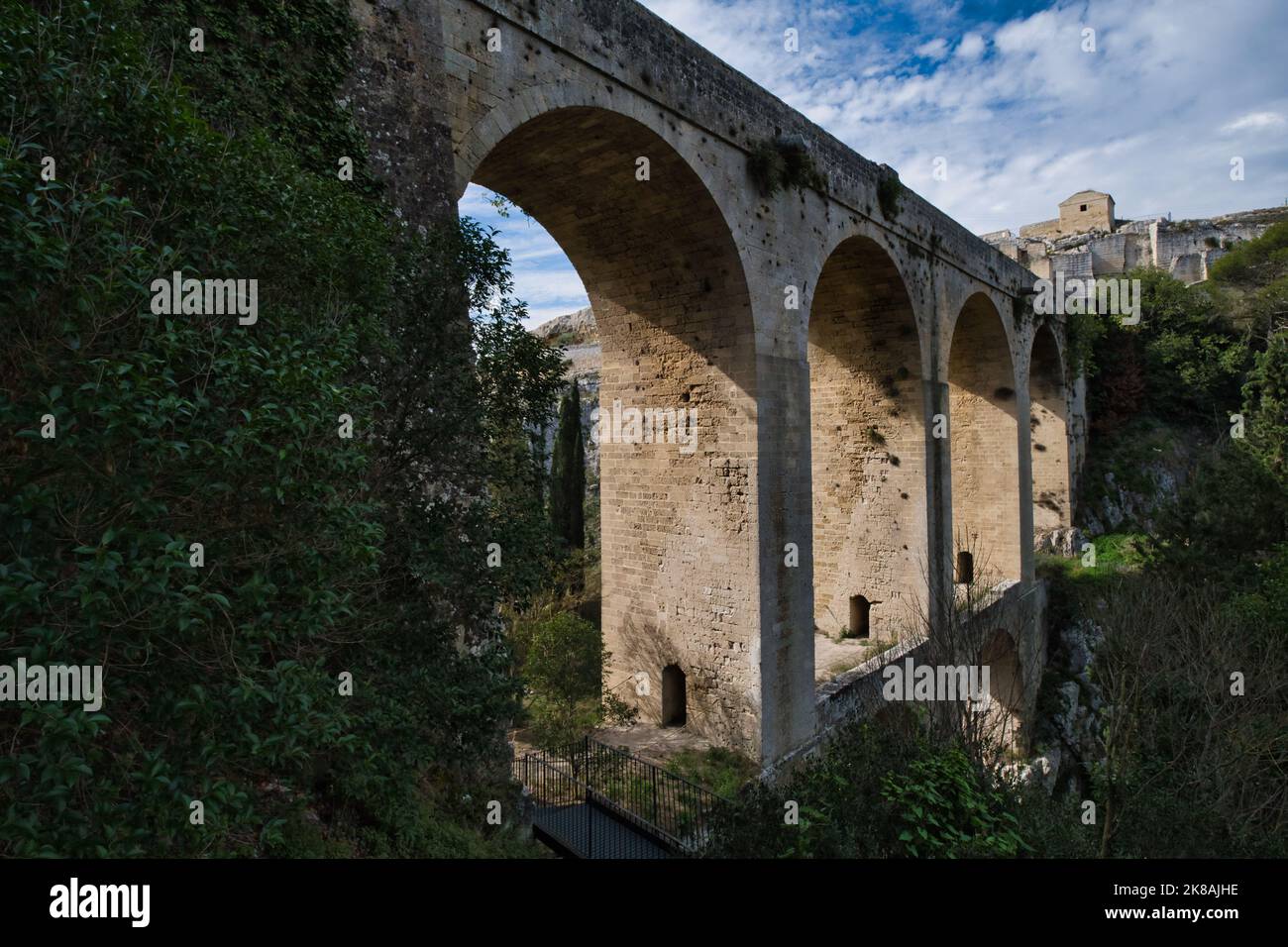 View of the monumental aqueduct bridge in Gravina in Puglia, near Matera Stock Photo
