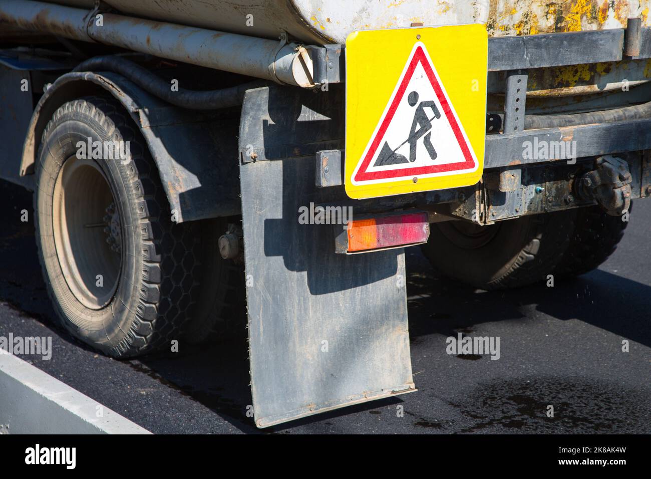 Repair vehicle with signs fixed on board - repair work Stock Photo - Alamy