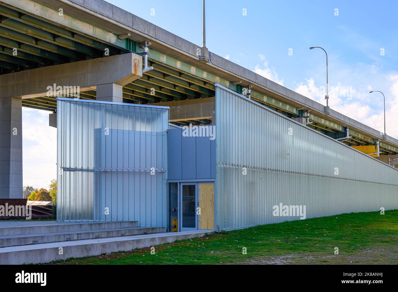 A modern architectural structure contrasts with the Gardiner Expressway. Stock Photo