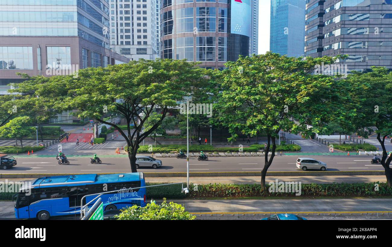 Aerial view of the Sudirman avenue in the heart of Jakarta business district with the foot bridge to link the Transjakarta bus shelter in the middle Stock Photo