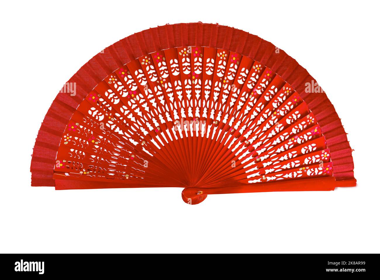 Spanish red open hand fan, decorated with floral motifs, isolated on white background Stock Photo