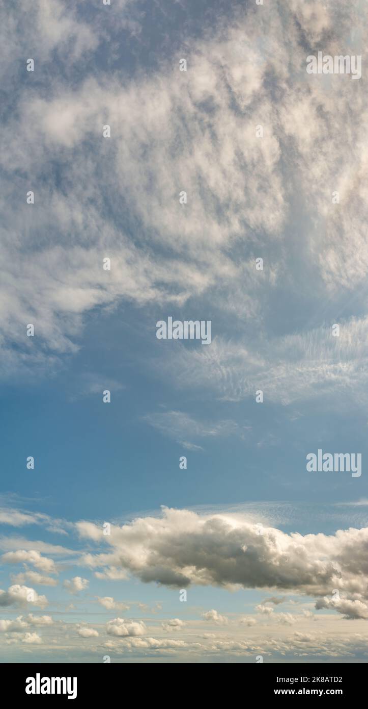 Fantastic clouds at sunrise, vertical panorama Stock Photo - Alamy