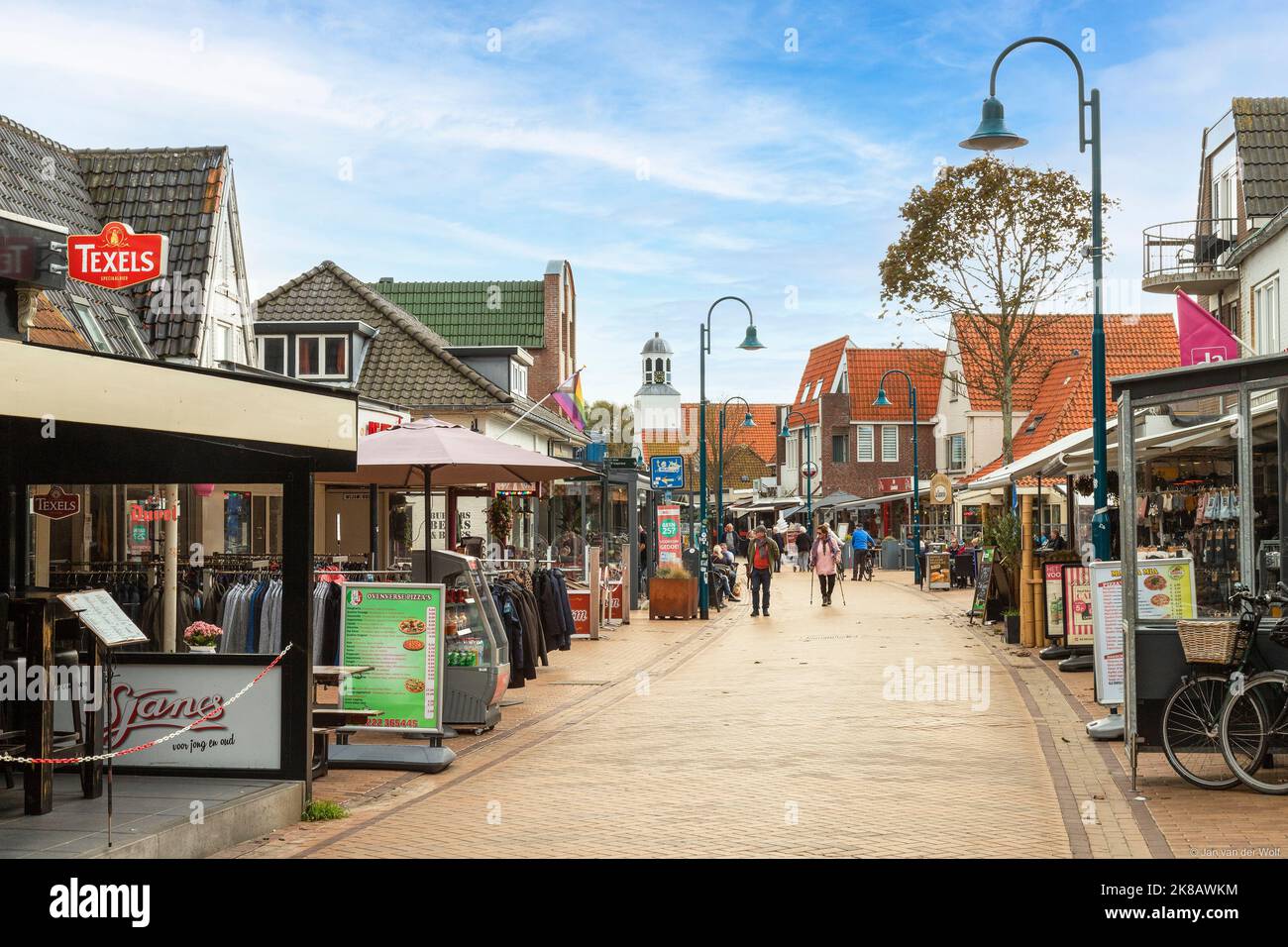 Street in the center of the small touristic village De Koog on the Wadden Island of Texel, the Netherlands. Stock Photo
