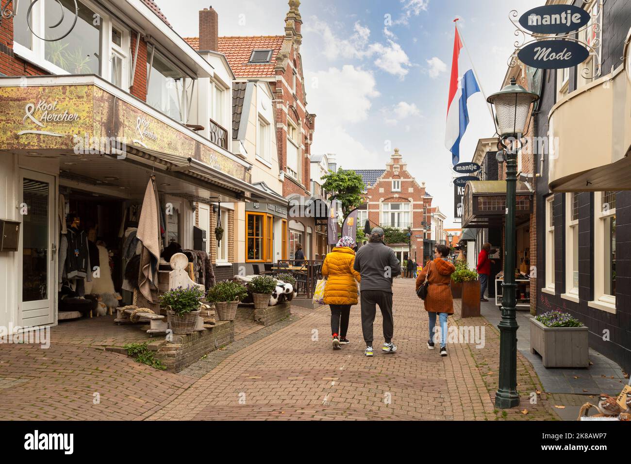 Cozy shopping street in the center of the small tourist village of Den Burg on the Dutch Wadden Island of Texel. Stock Photo