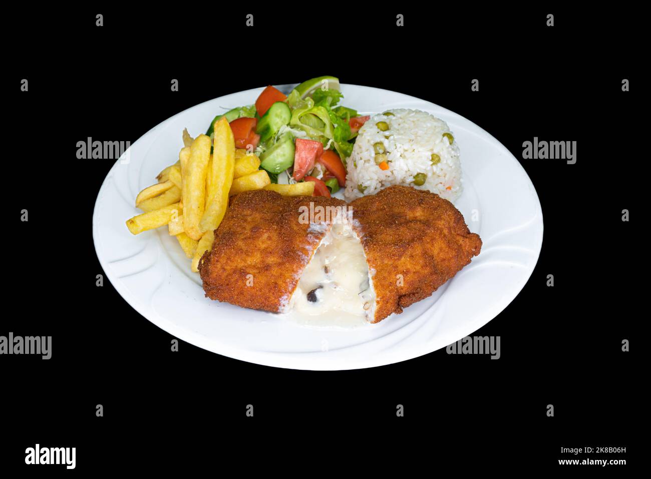 Stuffed chicken wings in a white plate on a black background Stock Photo