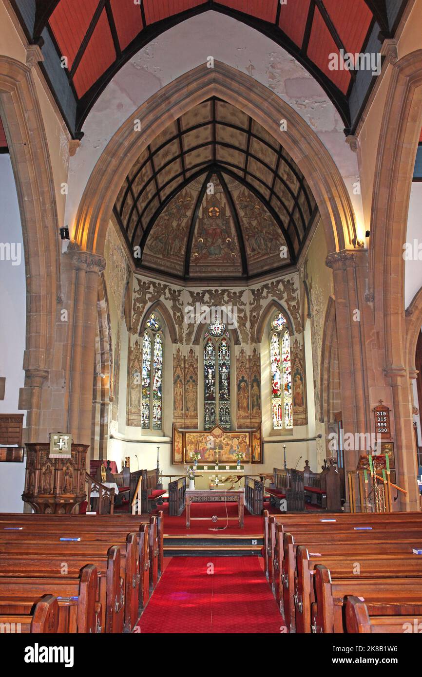 St James Church, New Brighton. Paintings, stained glass and reredos all designed by the eminent Victorian church artist Alfred O Hemming Stock Photo