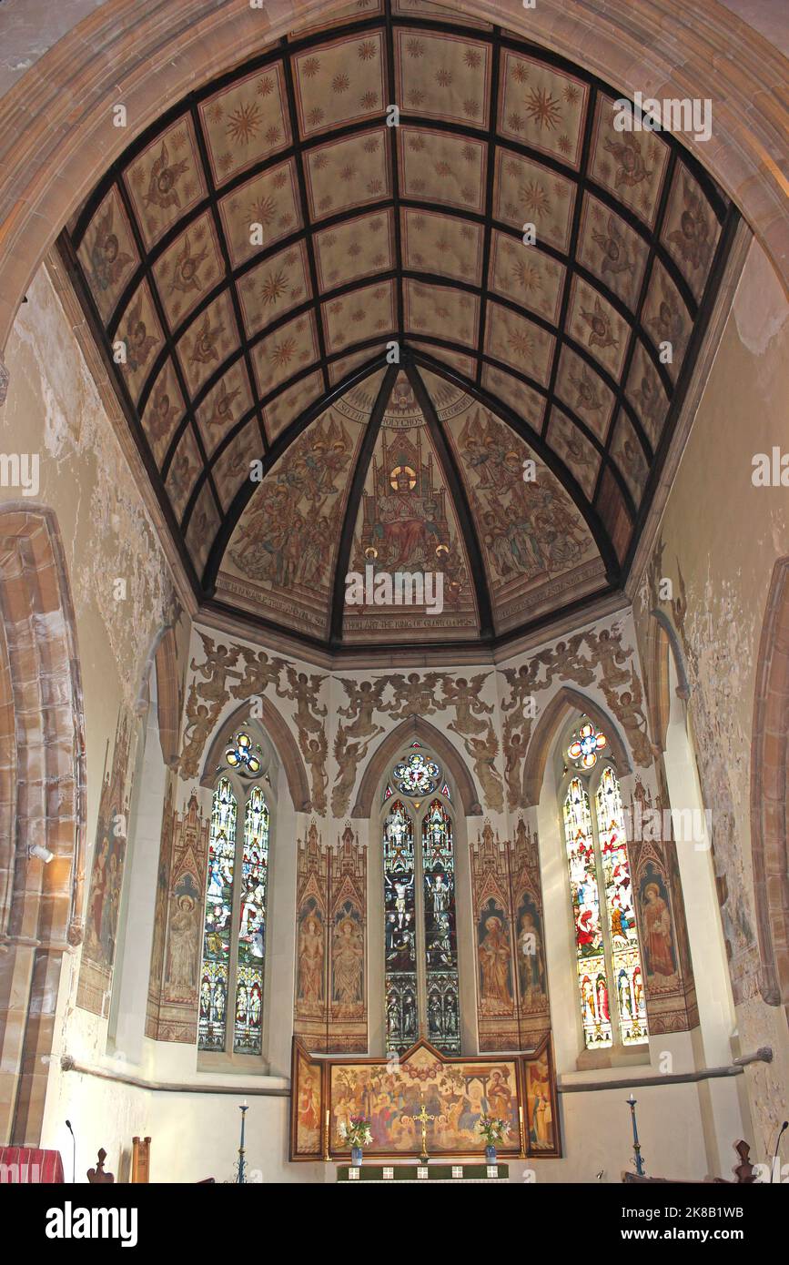 St James Church, New Brighton. Paintings, stained glass and reredos all designed by the eminent Victorian church artist Alfred O Hemming Stock Photo
