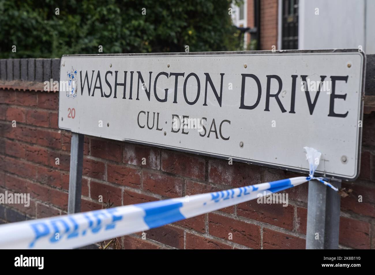 Washington Drive, Birmingham - October 22nd 2022 - Two police forensic tents are placed outside a property on Washington Drive in Handsworth Wood after a man aged 29 was stabbed to death. Floral tributes and bottles of beer were left at the scene along with a heartfelt note from the mans brother. Pic Credit: Scott CM/Alamy Live News Stock Photo