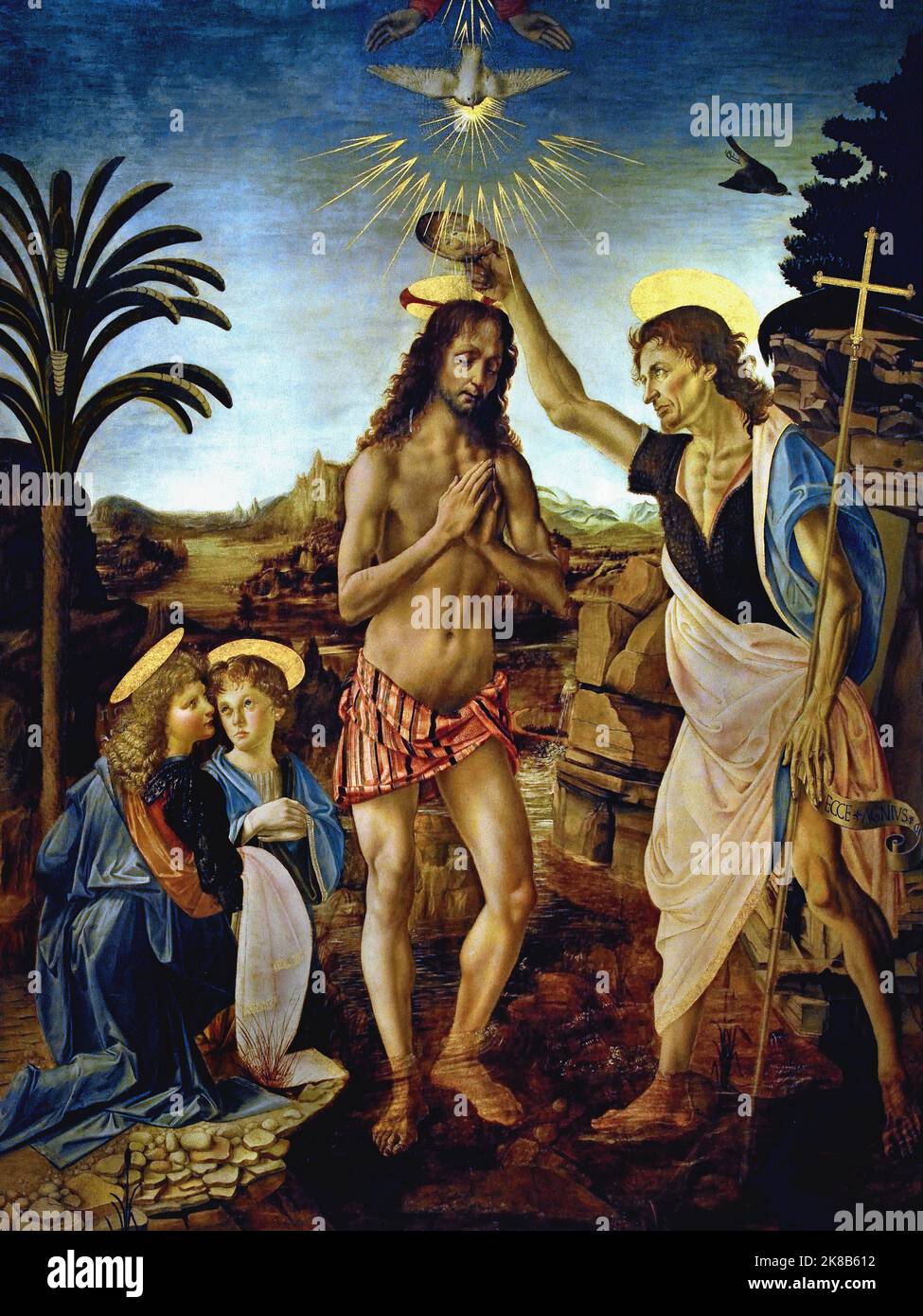 The Baptism of Christ, Andrea del Verrocchio, (Florence 1435- Venice 1488) ,Leonardo da Vinci, (Vinci 1452 – Amboise 1519) , Florence, Italy. ( On the banks of the River Jordan in Palestine, Jesus is being baptized by St John, who is wetting Christ’s head with water. ) Stock Photo
