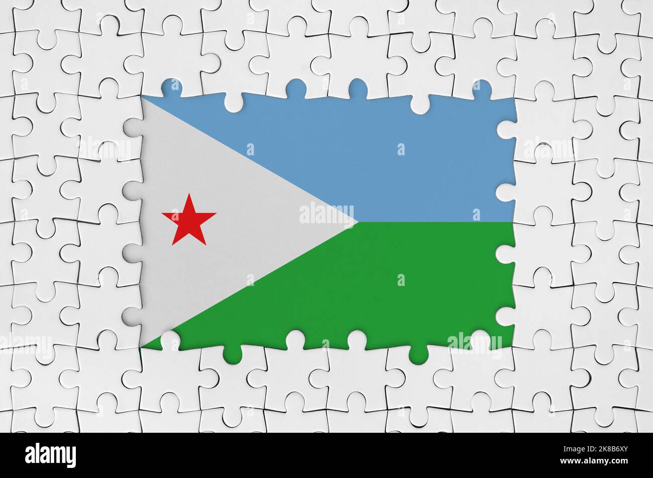 Djibouti flag in frame of white puzzle pieces with missing central parts Stock Photo