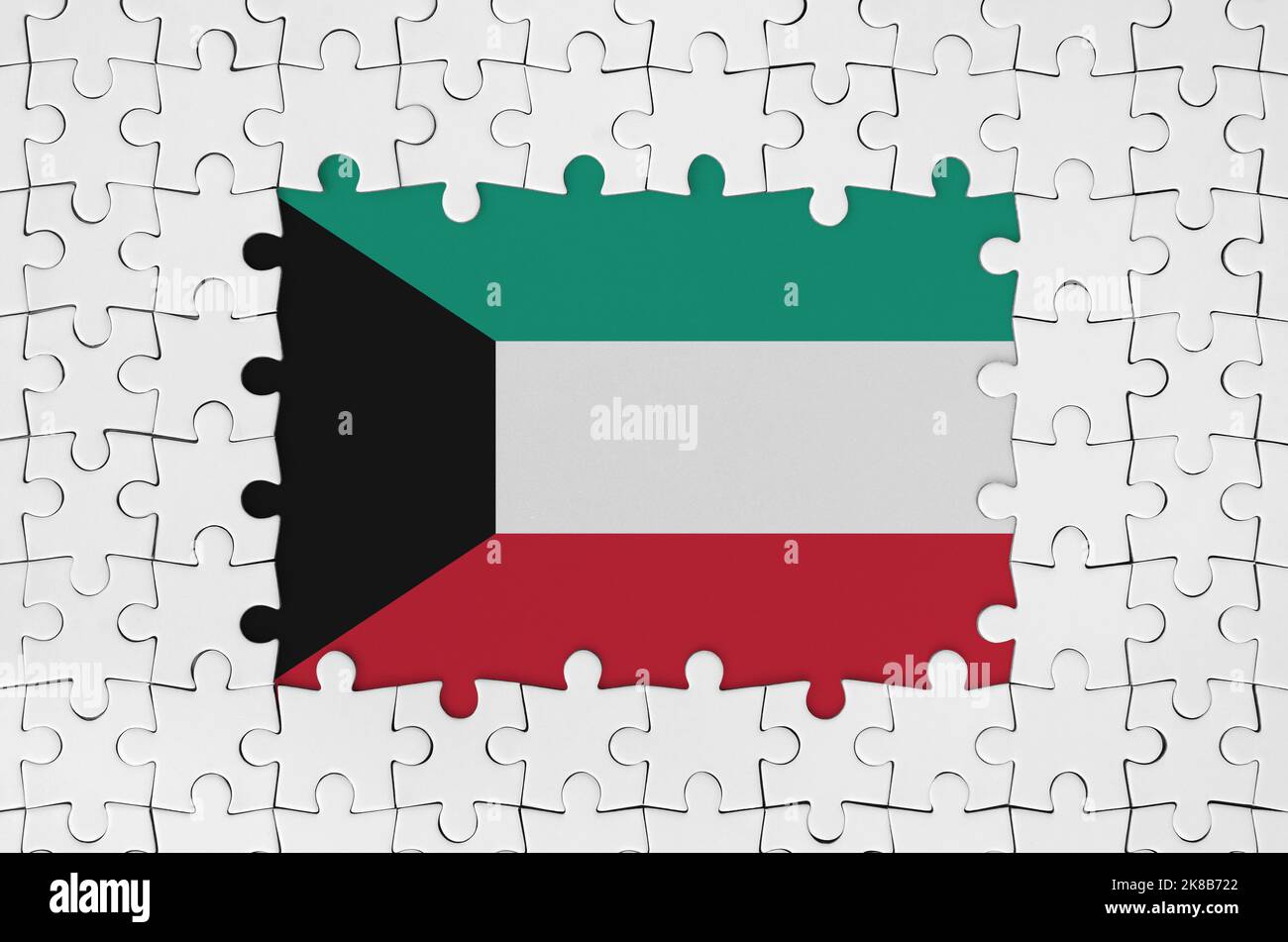 Kuwait flag in frame of white puzzle pieces with missing central parts
